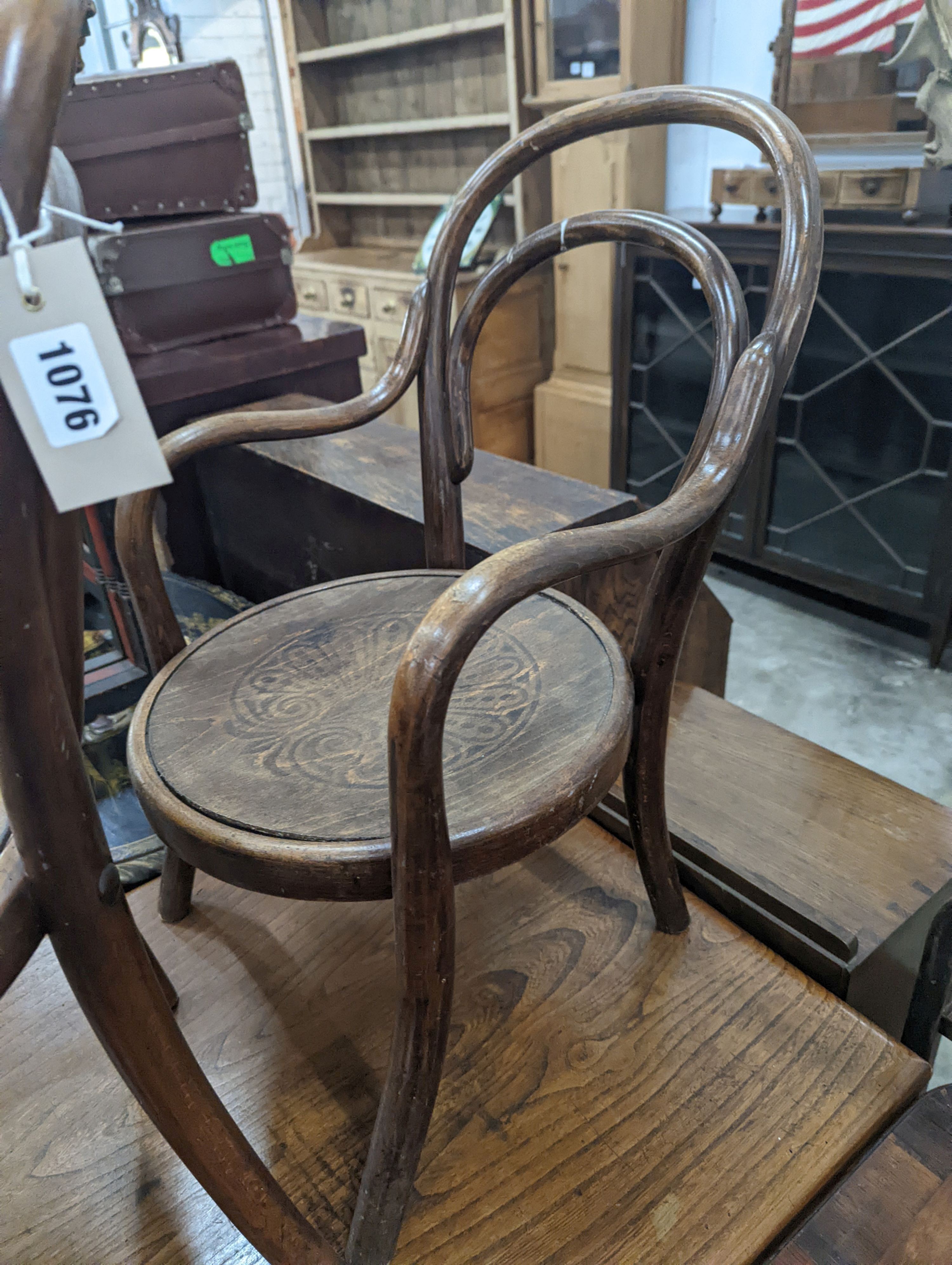 A near pair of early 20th century beech bentwood childs elbow chairs